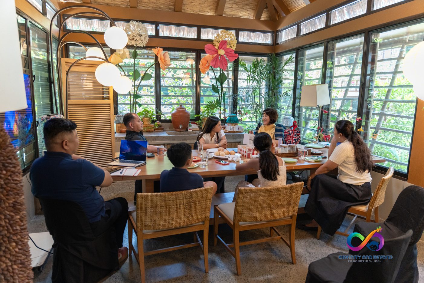 The Foundation’s delegation seated at a long table in a sunlit room.